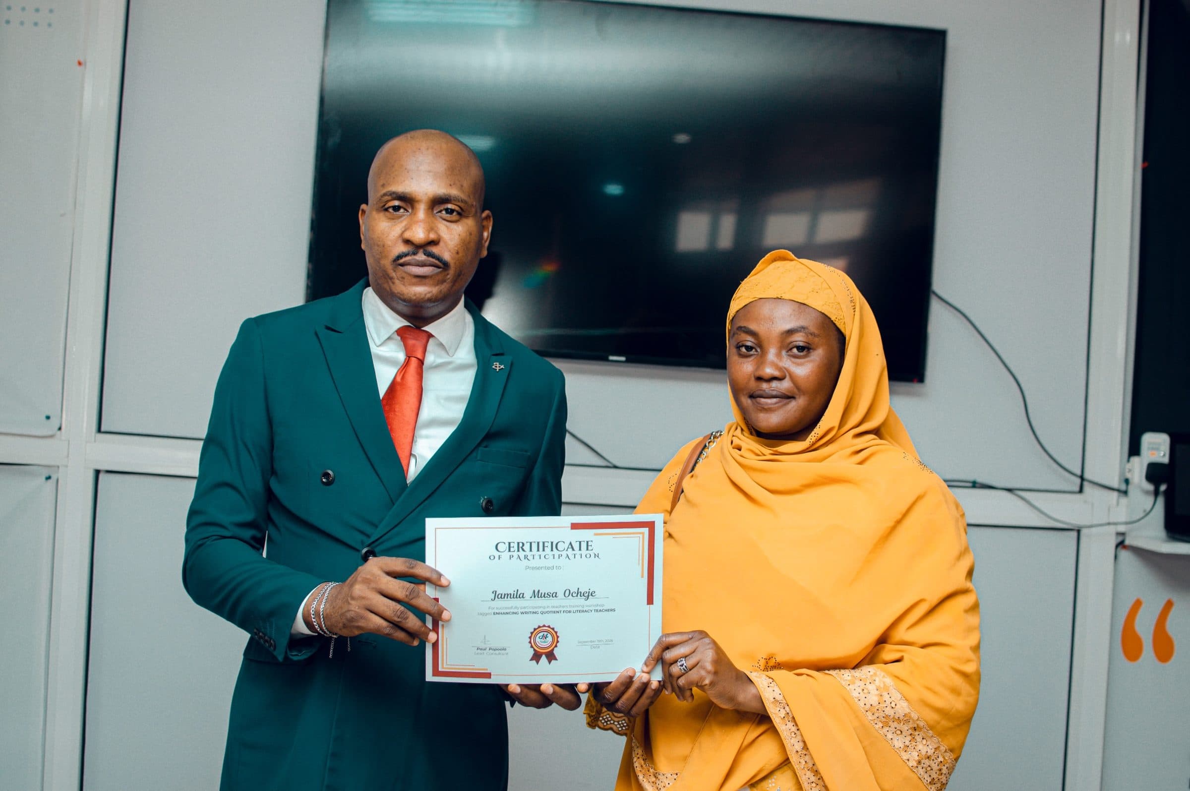 Participant receiving a certificate from the lead consultant