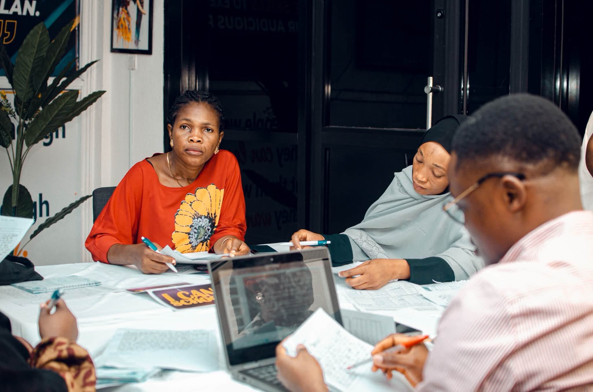 Participants working together at a workshop table
